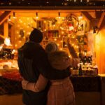 happy senior couple hugging at christmas market